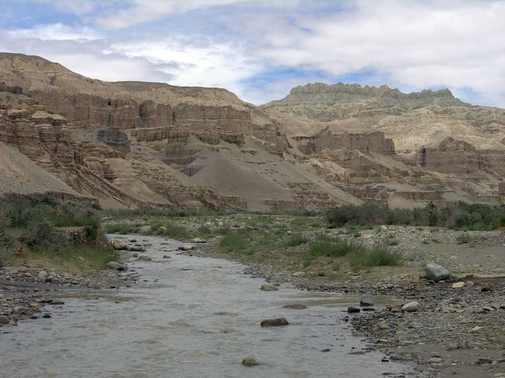 Tibet Guge 01 To 19 Sutlej Canyon Exit We enter narrow deep gullies; corridors in fantastic castles; from time to time, wide spaces on which stand vertically towers and peaks  contorted, ponderous  or there rise solitary monolithic columns with enormous capitals. - Giuseppi Tucci: Secrets of Tibet (September 18, 1933)